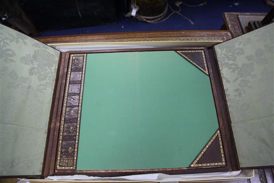 A French gilt tooled and brown leather double folding desk blotter, W.1ft 8in.